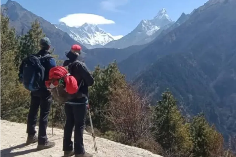Trekkers viewing snow-covered Himalayan peaks during the Everest Base Camp Trek in May.