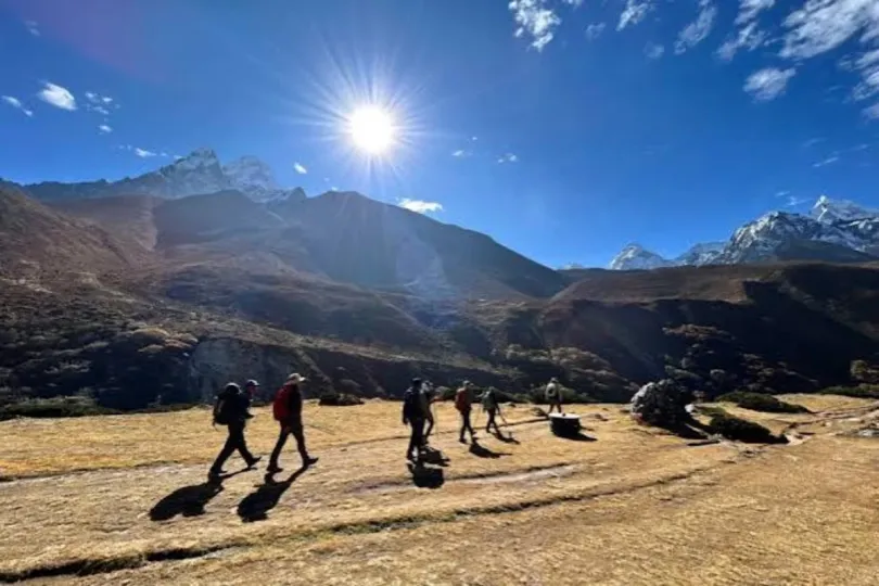 Trekkers enjoying clear October weather and Himalayan mountain views on the Everest Base Camp trail