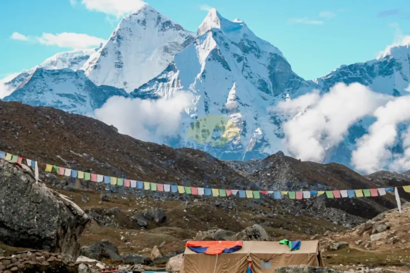 Everest Base Camp route with Himalayan peaks and prayer flags