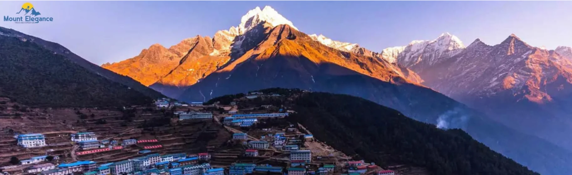 Sunrise over Mt. Kongde and Namche Bazaar village.