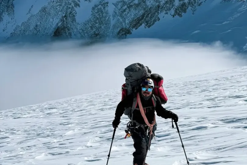 Nims Purja climbing a snowy Himalayan peak