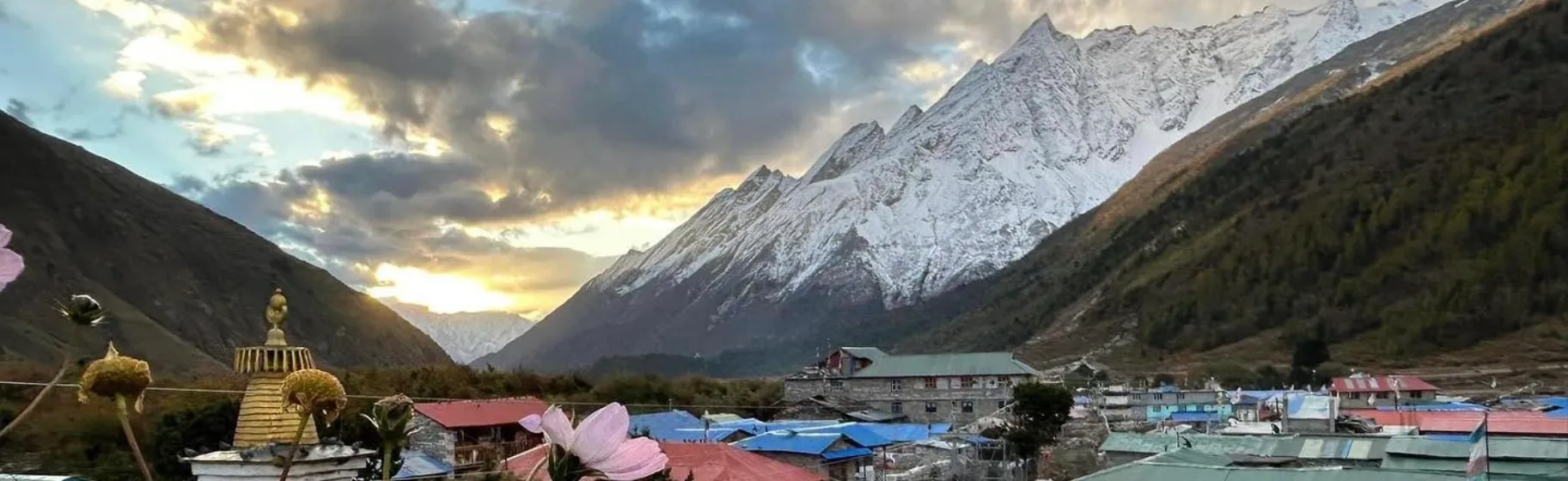 Pangboche village with stupa, flowers, and Himalayan mountain sunset.