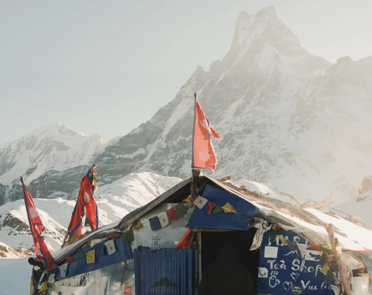 Mountain tea house on the Mardi Himal Trek route with snow-covered Himalayan peaks in Nepal’s Annapurna region.