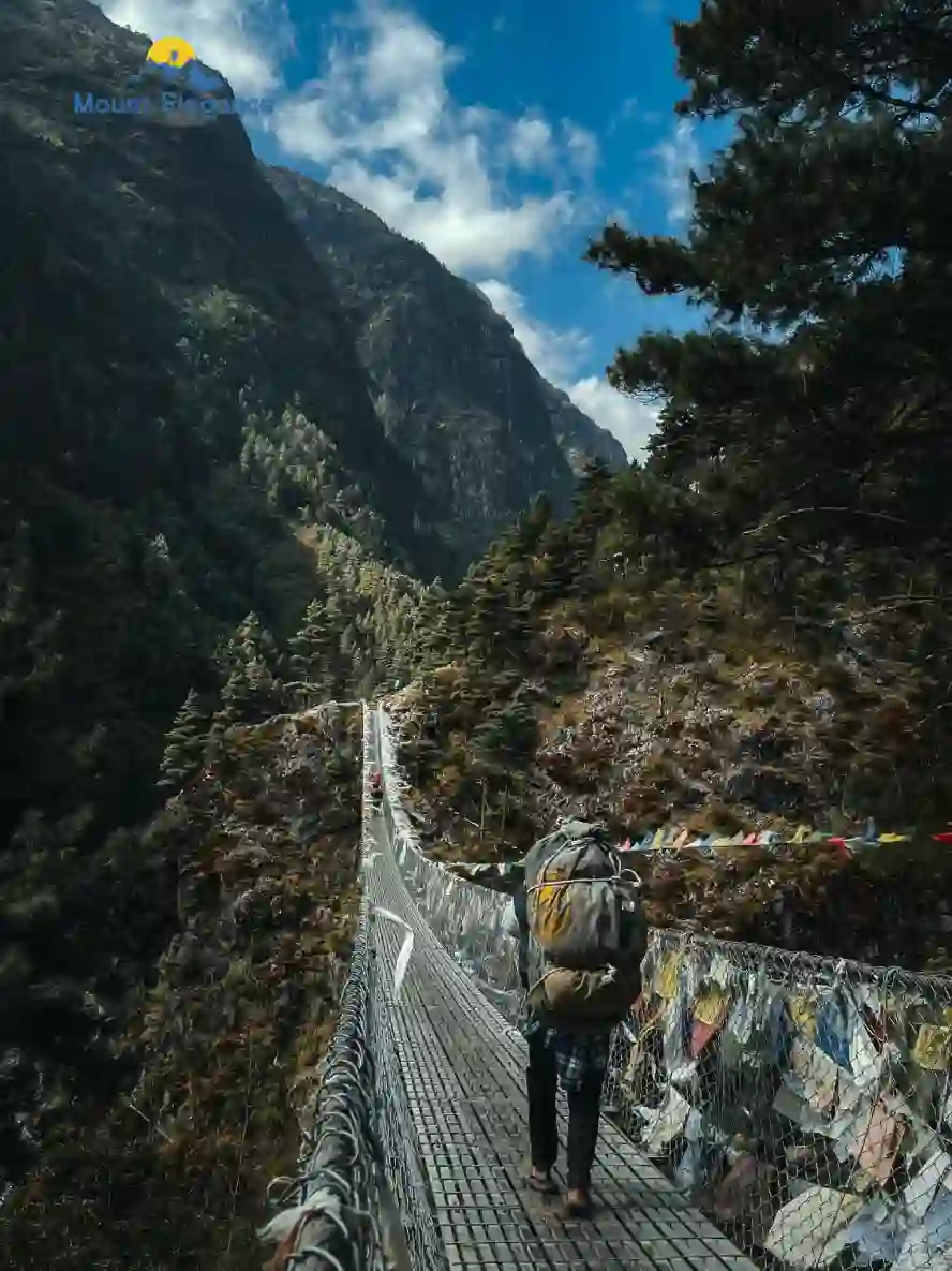 Suspension bridge with prayer flags over the Dudh Kosi River near Phakding