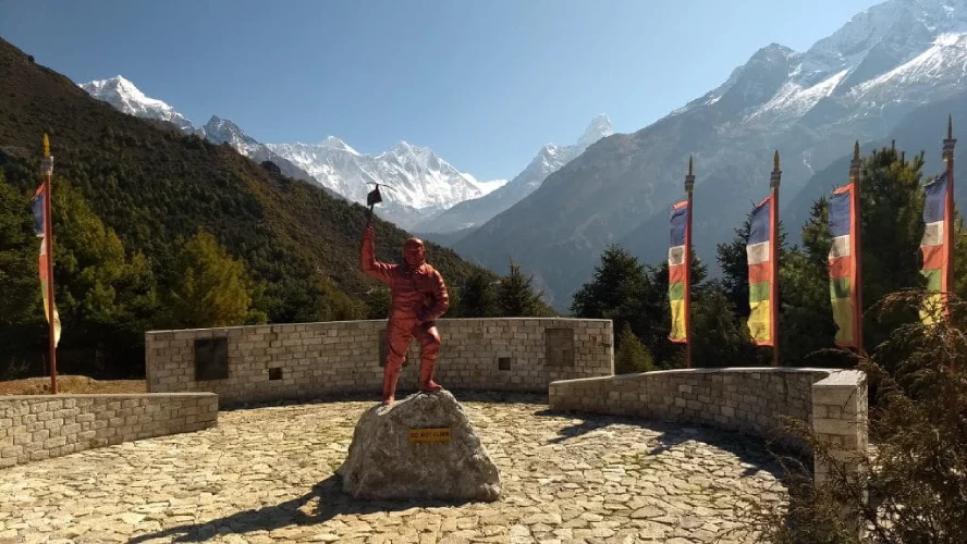 Sherpa Museum in Namche Bazaar, featuring a statue of Tenzing Norgay and the Hall of Fame gallery of Everest summiteers.